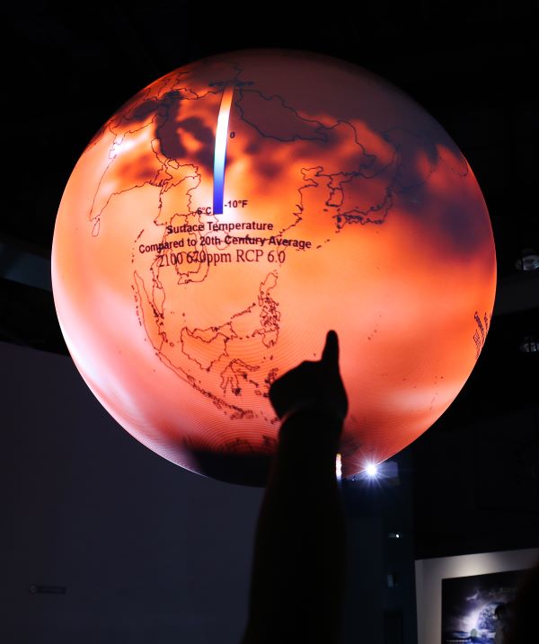  On July 30, amidst a special heat wave declaration in most parts of the country, visitors at the Daegu National Science Museum explore an indoor exhibition featuring the SOS system, representing the El Niño phenomenon during the ongoing climate crisis.