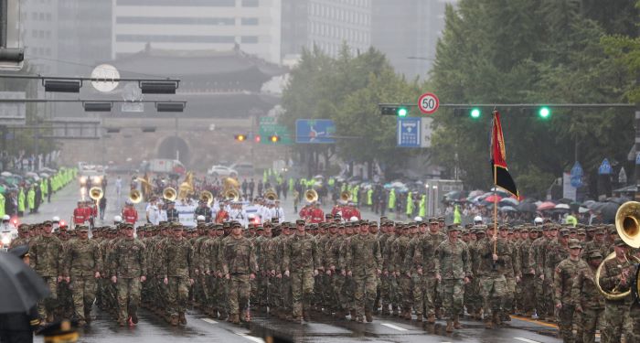 Soldiers of the U.S. 8th Army march in a parade near Gwanghwamun Square in Seoul, South Korea, during the 75th Armed Forces Day parade.