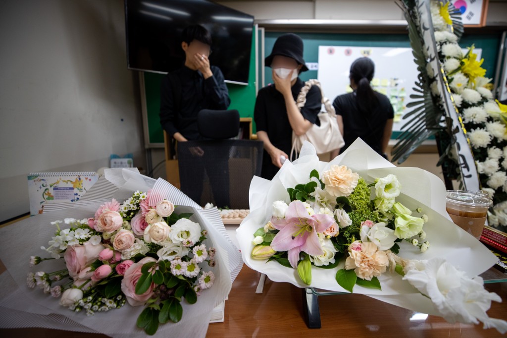 Relatives of the deceased look around a classroom at Seoi Elementary School in Seoul, South Korea, on the afternoon of Sept. 4, the 49th anniversary of the teacher's death.