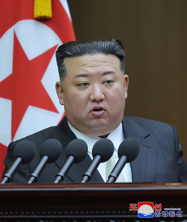 This photo, carried by North Korea's official Korean Central News Agency on Sept. 28, 2023, shows North Korean leader Kim Jong-un delivering a speech at the ninth session of the 14th Supreme People's Assembly (SPA) on Sept. 26-27 in Pyongyang. (Image courtesy of Yonhap)